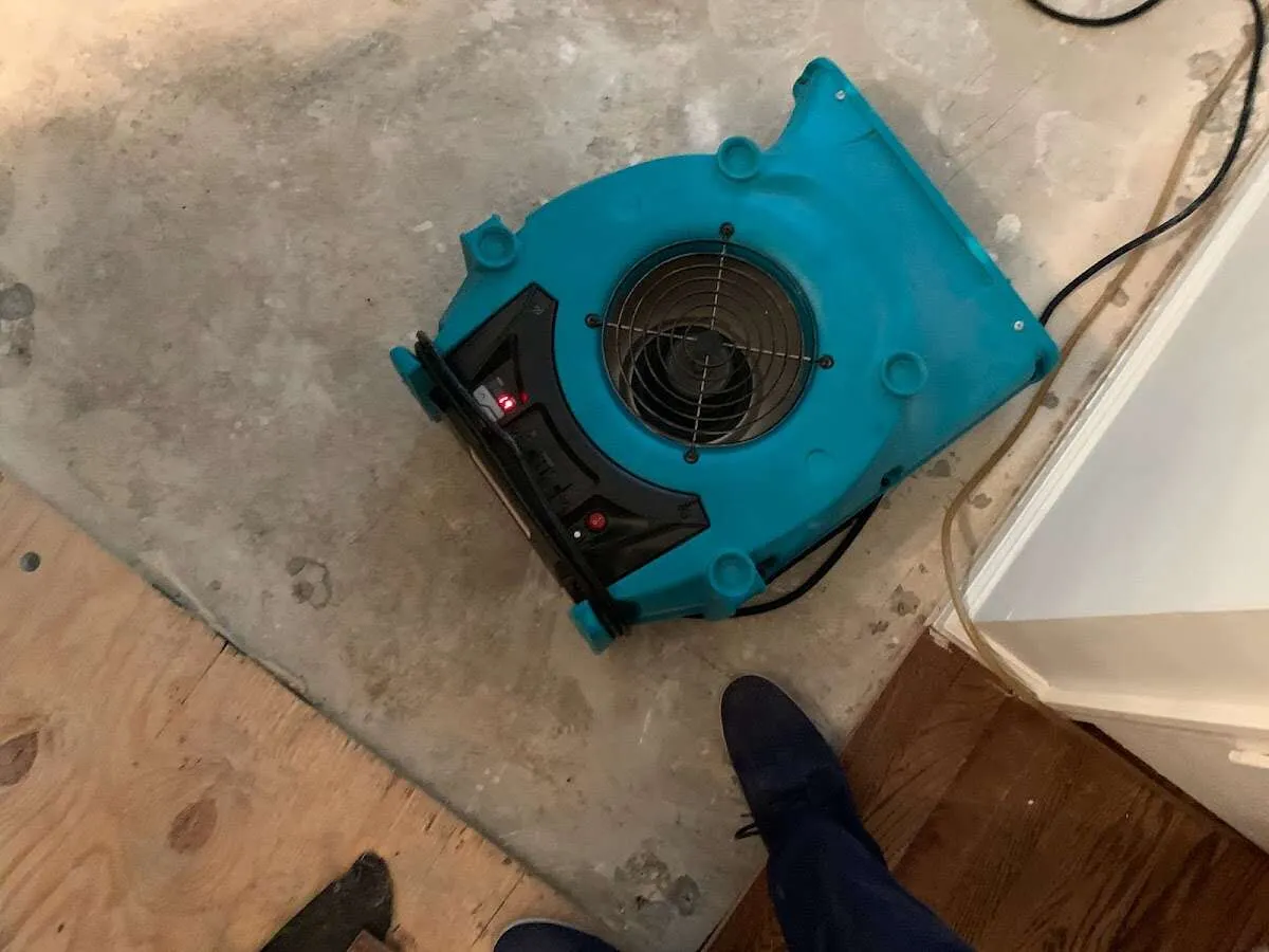 Air mover drying subfloor during Leak Detection & Repair in Wheaton